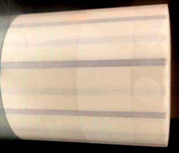 Produktbild - 60794 - Etikett bobin 25mm transparent PET med runda hörn 60x20mm och vit Ø9mm 1000st/rulle
