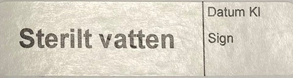 Produktbild - 62565 - Etikett sterilt vatten vit/svart 12x50mm 500st/rulle